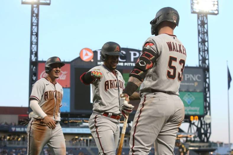 Jun 3, 2022; Pittsburgh, Pennsylvania, USA;  Arizona Diamondbacks second baseman Ketel Marte (middle) celebrates his two-run home run with first baseman Christian Walker (53) against the Pittsburgh Pirates during the fifth inning at PNC Park. Mandatory Credit: Charles LeClaire-USA TODAY Sports