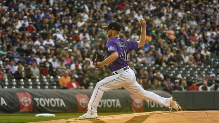 Jun 3, 2022; Denver, Colorado, USA; Colorado Rockies starting pitcher Chad Kuhl (41) delivers a pitch in the first inning against the Atlanta Braves at Coors Field. Mandatory Credit: John Leyba-USA TODAY Sports