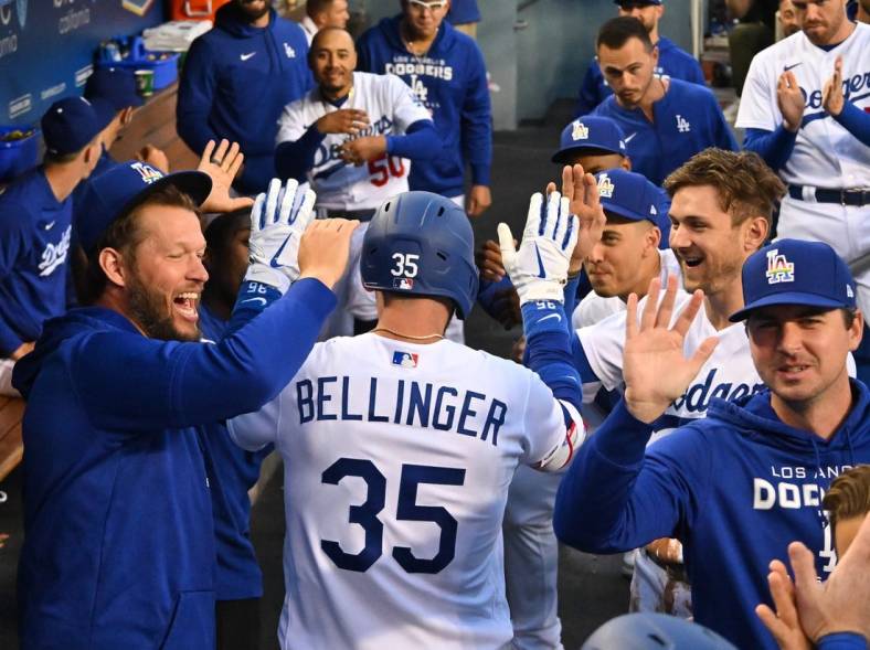 Jun 3, 2022; Los Angeles, California, USA; Los Angeles Dodgers center fielder Cody Bellinger (35) celebrates with teammates in the dugout after hitting a two-run home run scoring third baseman Justin Turner (not pictured) in the second inning against the New York Mets at Dodger Stadium. Mandatory Credit: Jayne Kamin-Oncea-USA TODAY Sports
