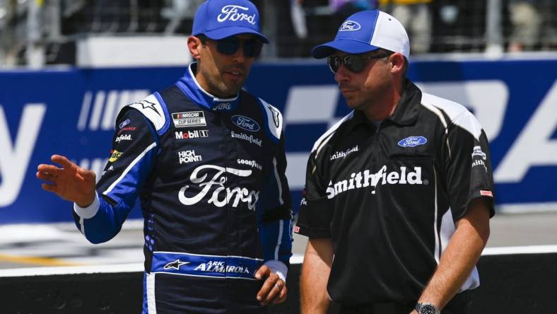 Jun 4, 2022; Madison, Illinois, USA; NASCAR Cup Series driver Chase Briscoe (14) speaks with a crew member during Nascar Cup qualifying at World Wide Technology Raceway at Gateway. Mandatory Credit: Joe Puetz-USA TODAY Sports