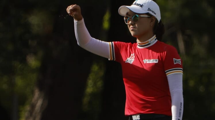 Jun 4, 2022; Southern Pines, North Carolina, USA; Minjee Lee checks the wind prior to hitting an approach shot on the sixteenth hole during the third round of the U.S. Women's Open. Mandatory Credit: Geoff Burke-USA TODAY Sports
