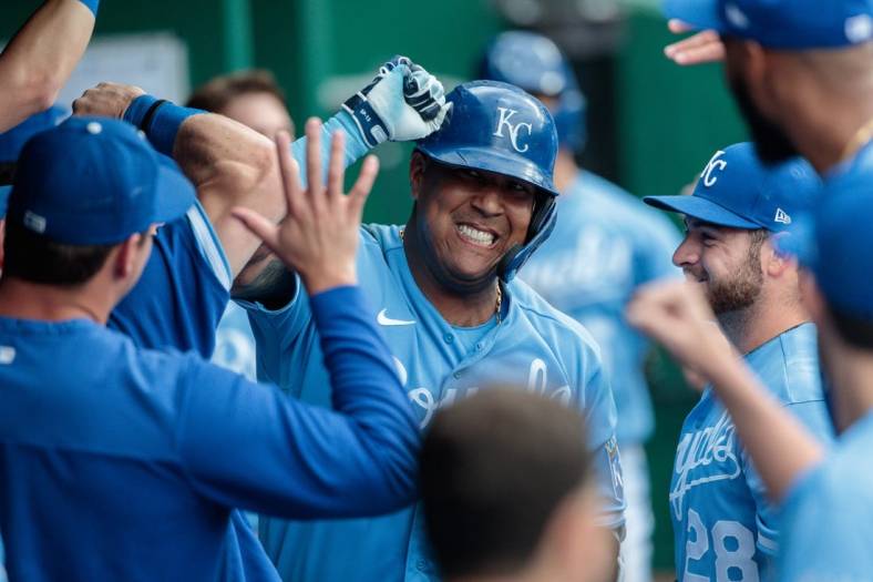 Jun 4, 2022; Kansas City, Missouri, USA; Kansas City Royals catcher Salvador Perez (13) celebrates in the dugout after hitting a home run against the Houston Astros during the sixth inning at Kauffman Stadium. Mandatory Credit: William Purnell-USA TODAY Sports