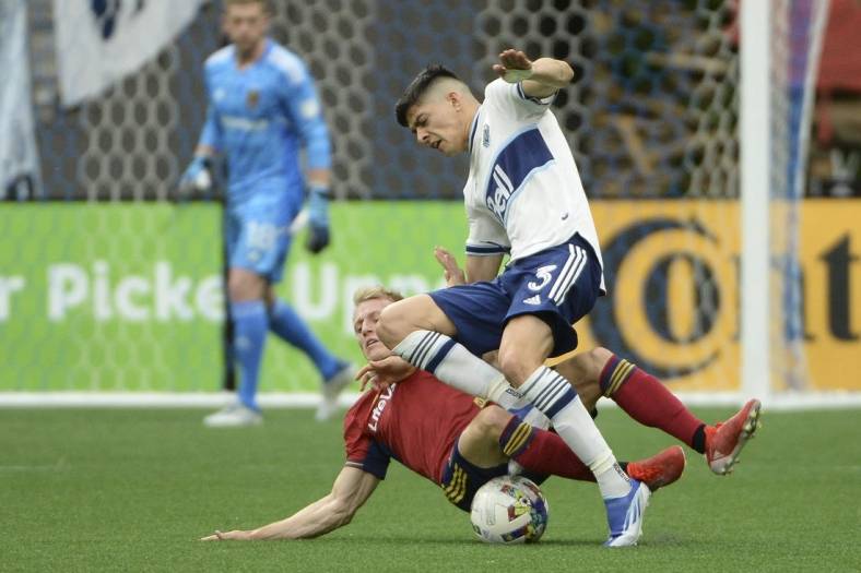 Jun 4, 2022; Vancouver, British Columbia, CAN;  Real Salt Lake defender Jasper Loffelsend (28) challenges Vancouver Whitecaps defender Cristian Gutierrez (3) during the first half at BC Place. Mandatory Credit: Anne-Marie Sorvin-USA TODAY Sports