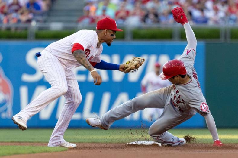 Jun 4, 2022; Philadelphia, Pennsylvania, USA; Los Angeles Angels starting pitcher Shohei Ohtani (17) is tagged out by Philadelphia Phillies shortstop Johan Camargo (7) while attempting to steal second base during the first inning at Citizens Bank Park. Mandatory Credit: Bill Streicher-USA TODAY Sports