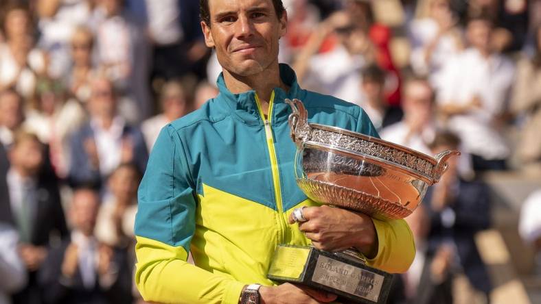 June 5, 2022; Paris, France; Rafael Nadal (ESP) poses with the trophy after winning  the men s singles final against Casper Ruud (NOR) on day 15 of the French Open at Stade Roland-Garros. Mandatory Credit: Susan Mullane-USA TODAY Sports