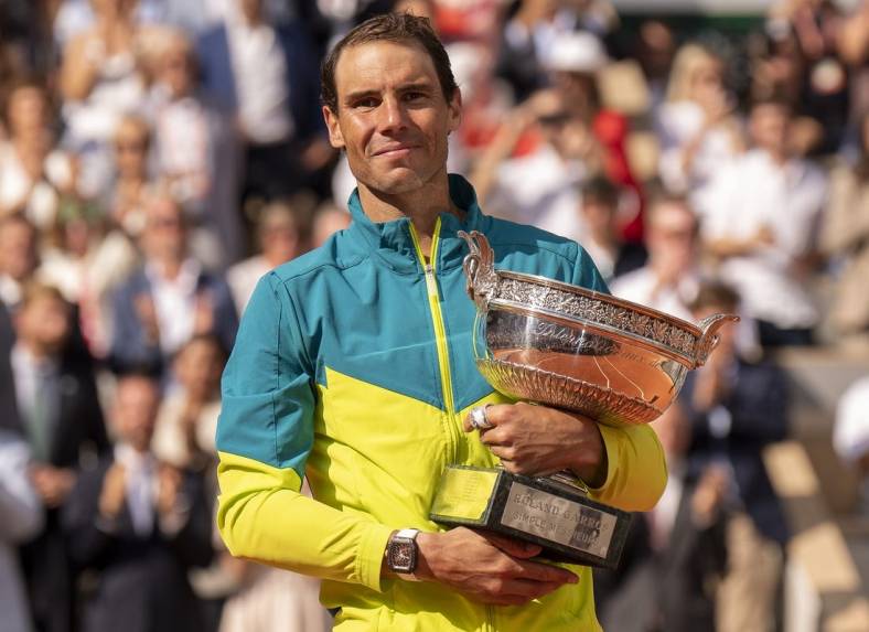 June 5, 2022; Paris, France; Rafael Nadal (ESP) poses with the trophy after winning  the men s singles final against Casper Ruud (NOR) on day 15 of the French Open at Stade Roland-Garros. Mandatory Credit: Susan Mullane-USA TODAY Sports