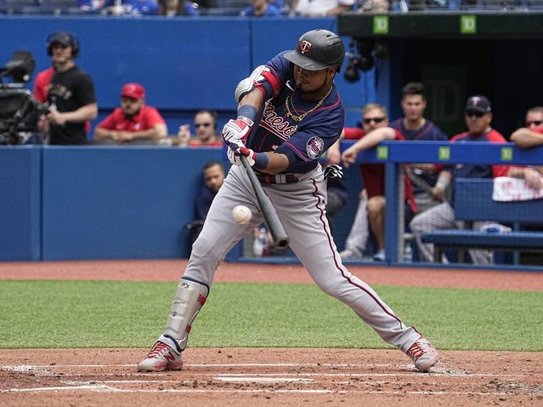 Jun 5, 2022; Toronto, Ontario, CAN; Minnesota Twins designated hitter Luis Arraez (2) hits a single against the Toronto Blue Jays during the second inning at Rogers Centre. Mandatory Credit: John E. Sokolowski-USA TODAY Sports