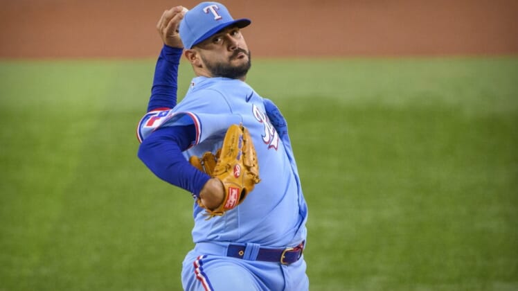 Jun 5, 2022; Arlington, Texas, USA; Texas Rangers starting pitcher Martin Perez (54) pitches against the Seattle Mariners during the first inning at Globe Life Field. Mandatory Credit: Jerome Miron-USA TODAY Sports