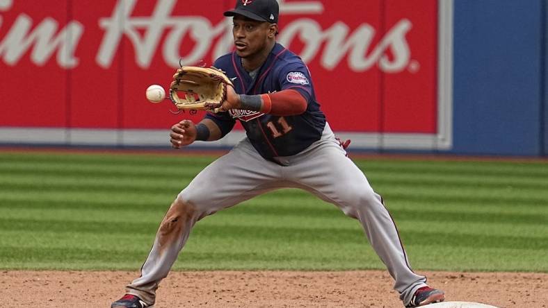 Jun 5, 2022; Toronto, Ontario, CAN; Minnesota Twins second baseman Jorge Polanco (11) makes a catch at second base to put out Toronto Blue Jays pinch runner Bradley Zimmer (not pictured) during the ninth inning at Rogers Centre. Mandatory Credit: John E. Sokolowski-USA TODAY Sports