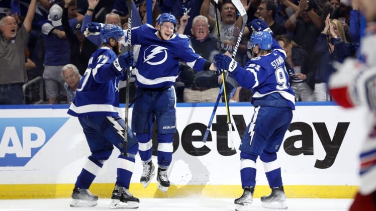 Jun 5, 2022; Tampa, Florida, USA; Tampa Bay Lightning left wing Ondrej Palat (18) celebrates with defenseman Victor Hedman (77) and center Steven Stamkos (91) after scoring a goal against the New York Rangers during the third period of the Eastern Conference Final of the 2022 Stanley Cup Playoffs at Amalie Arena. Mandatory Credit: Kim Klement-USA TODAY Sports