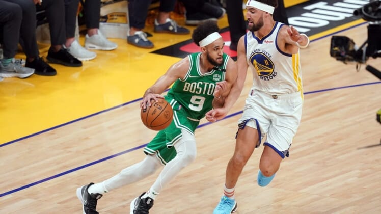 Jun 5, 2022; San Francisco, California, USA; Boston Celtics guard Derrick White (9) dribbles against Golden State Warriors guard Klay Thompson (11) in the second quarter during game two of the 2022 NBA Finals at Chase Center. Mandatory Credit: Cary Edmondson-USA TODAY Sports