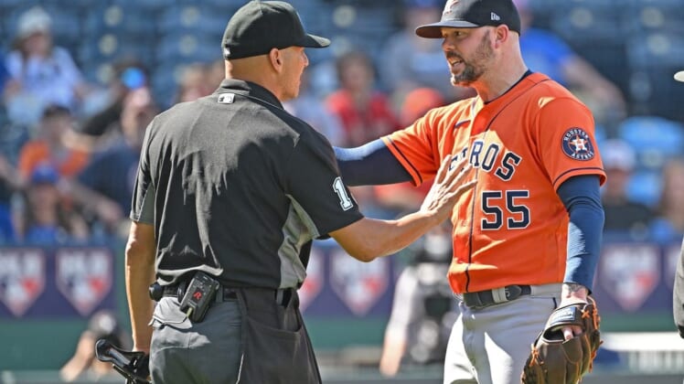 Jun 5, 2022; Kansas City, Missouri, USA;  Houston Astros relief pitcher Ryan Pressly (55) reacts after getting ejected from the game by home plate umpire Vic Carapazza (left) during the ninth inning against the Kansas City Royals at Kauffman Stadium. Mandatory Credit: Peter Aiken-USA TODAY Sports