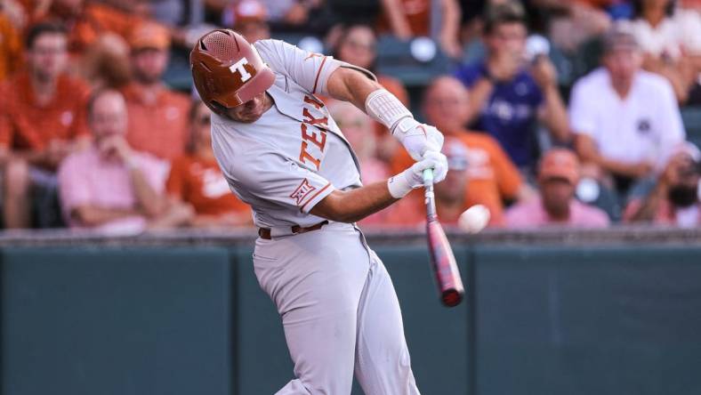 Texas infielder Ivan Melendez (17) hits a ball during the NCAA regional playoff game against Air Force at Disch-Falk Field in Austin, Texas on June 5, 2022.

Aem Texas V Air Force Ncaa G2 5