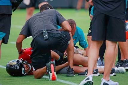 Jacksonville Jaguars quarterback C.J. Beathard (3) is looked at by trainers and personnel while participating in an organized team activity Monday, June 6, 2022 at TIAA Bank Field in Jacksonville.

Jki Ota7 59