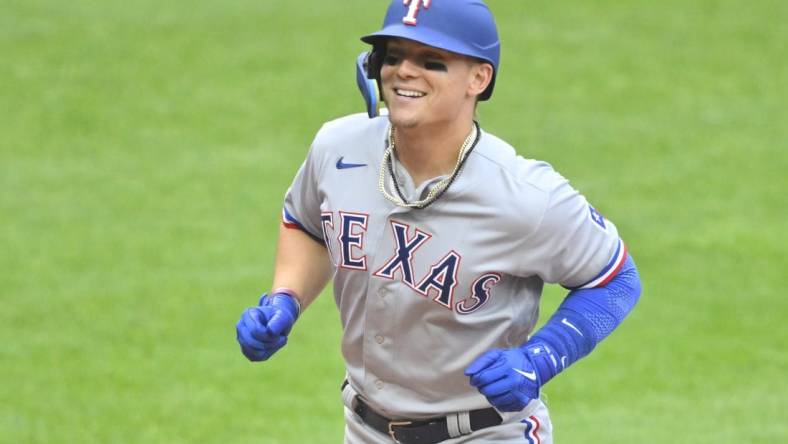 Jun 7, 2022; Cleveland, Ohio, USA; Texas Rangers left fielder Steele Walker (40) celebrates his solo home run in the seventh inning against the Cleveland Guardians at Progressive Field. Mandatory Credit: David Richard-USA TODAY Sports