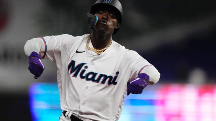 Jun 7, 2022; Miami, Florida, USA; Miami Marlins second baseman Jazz Chisholm Jr. (2) rounds the bases and flexes after connecting for a grand slam home run in the 2nd inning against the Washington Nationals at loanDepot park. Mandatory Credit: Jasen Vinlove-USA TODAY Sports