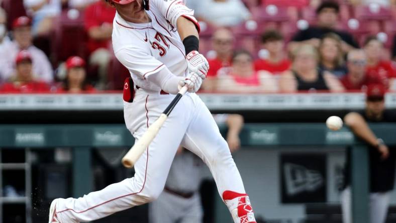 Jun 7, 2022; Cincinnati, Ohio, USA; Cincinnati Reds catcher Tyler Stephenson (37) hits an RBI single against the Arizona Diamondbacks during the second inning at Great American Ball Park. Mandatory Credit: David Kohl-USA TODAY Sports