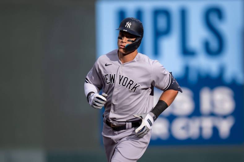 Jun 7, 2022; Minneapolis, Minnesota, USA;  New York Yankees right fielder Aaron Judge (99) hits a home run against the Minnesota Twins in the first inning at Target Field. Mandatory Credit: Brad Rempel-USA TODAY Sports