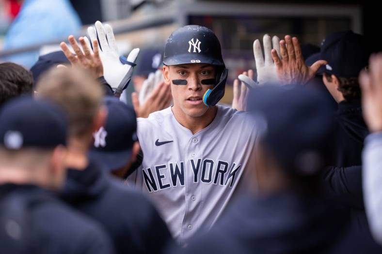 Jun 7, 2022; Minneapolis, Minnesota, USA;  New York Yankees right fielder Aaron Judge (99) celebrates his home run against the Minnesota Twins in the first inning at Target Field. Mandatory Credit: Brad Rempel-USA TODAY Sports