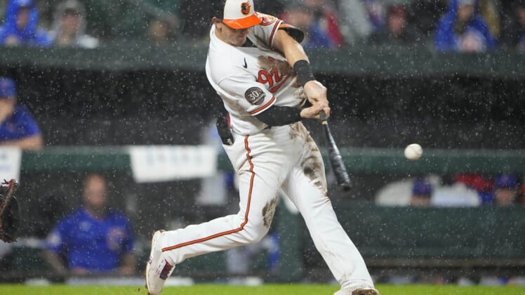 Jun 7, 2022; Baltimore, Maryland, USA; Baltimore Orioles left fielder Austin Hays (21) hits a home run against the Chicago Cubs during the fifth inning at Oriole Park at Camden Yards. Mandatory Credit: Gregory Fisher-USA TODAY Sports
