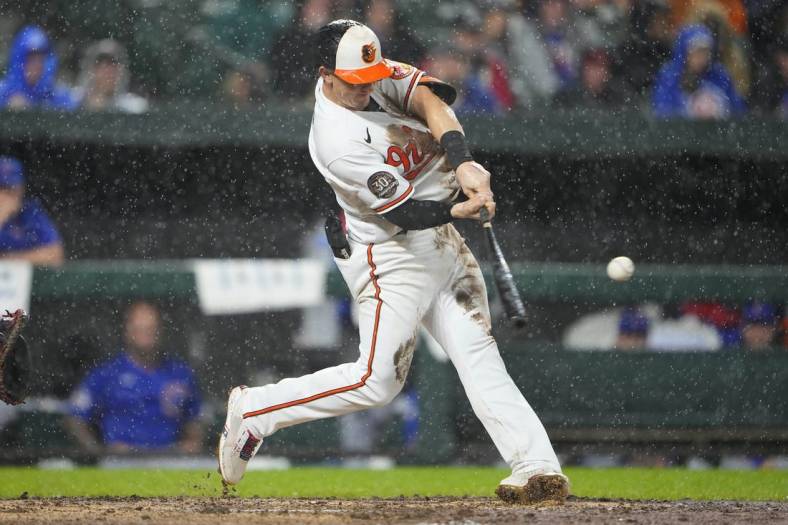 Jun 7, 2022; Baltimore, Maryland, USA; Baltimore Orioles left fielder Austin Hays (21) hits a home run against the Chicago Cubs during the fifth inning at Oriole Park at Camden Yards. Mandatory Credit: Gregory Fisher-USA TODAY Sports
