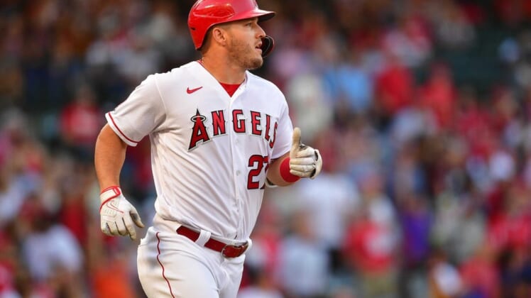 Jun 7, 2022; Anaheim, California, USA; Los Angeles Angels center fielder Mike Trout (27) runs after hitting a two run home run aganst the Boston Red Sox during the first inning at Angel Stadium. Mandatory Credit: Gary A. Vasquez-USA TODAY Sports