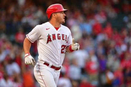 Jun 7, 2022; Anaheim, California, USA; Los Angeles Angels center fielder Mike Trout (27) runs after hitting a two run home run aganst the Boston Red Sox during the first inning at Angel Stadium. Mandatory Credit: Gary A. Vasquez-USA TODAY Sports
