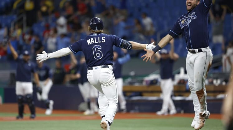 Jun 7, 2022; St. Petersburg, Florida, USA; Tampa Bay Rays shortstop Taylor Walls (6) celebrates as he hits a 3 run walk off home run during the tenth inning against the St. Louis Cardinals at Tropicana Field. Mandatory Credit: Kim Klement-USA TODAY Sports