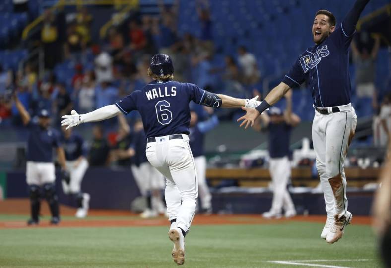 Jun 7, 2022; St. Petersburg, Florida, USA; Tampa Bay Rays shortstop Taylor Walls (6) celebrates as he hits a 3 run walk off home run during the tenth inning against the St. Louis Cardinals at Tropicana Field. Mandatory Credit: Kim Klement-USA TODAY Sports
