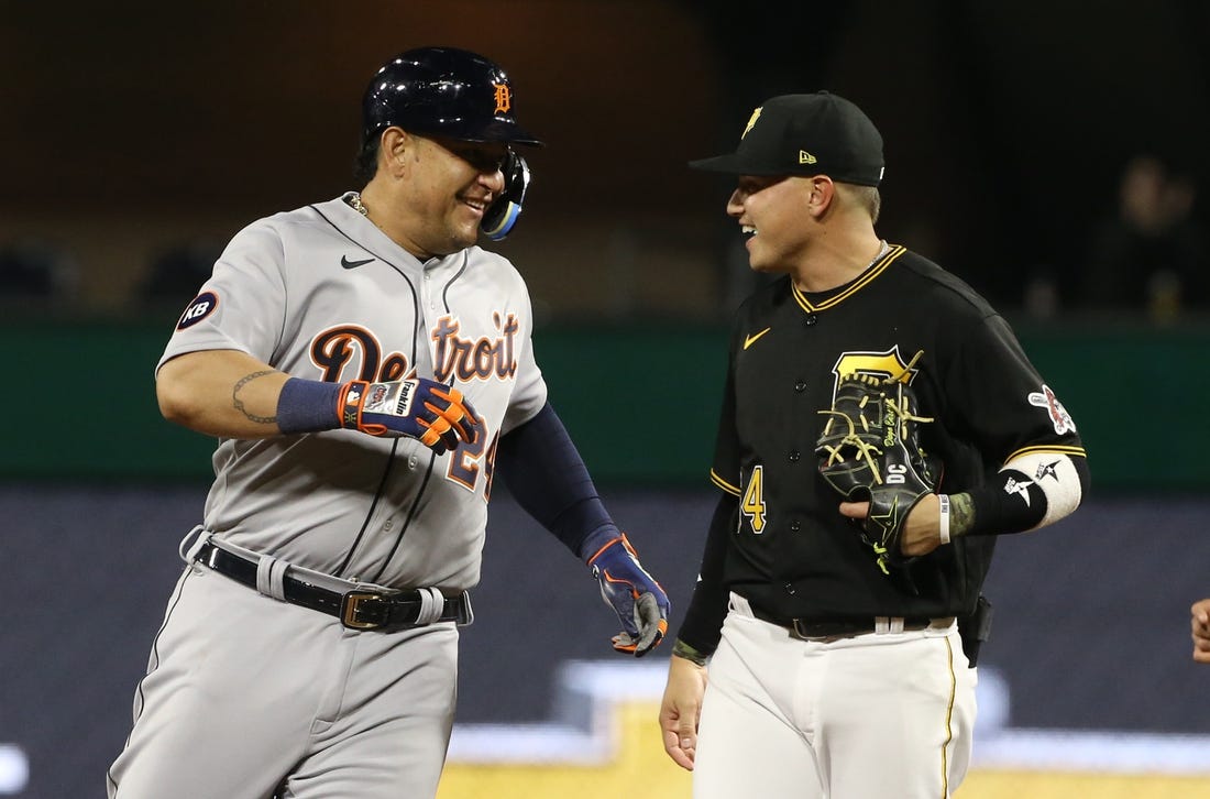 Jun 7, 2022; Pittsburgh, Pennsylvania, USA;  Detroit Tigers designated hitter Miguel Cabrera (24) and Pittsburgh Pirates shortstop Diego Castillo (64) share a laugh after a force out at second base to end the fifth inning at PNC Park. Mandatory Credit: Charles LeClaire-USA TODAY Sports