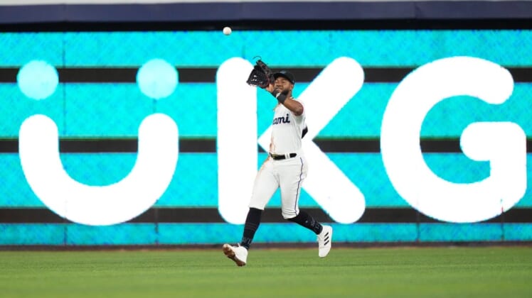 Jun 8, 2022; Miami, Florida, USA; Miami Marlins center fielder Bryan De La Cruz (14) makes a catch for an out in the 3rd inning against the Washington Nationals at loanDepot park. Mandatory Credit: Jasen Vinlove-USA TODAY Sports