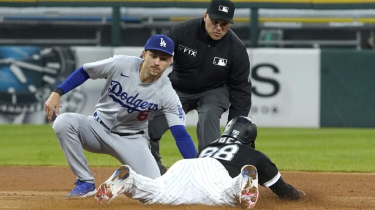 Jun 8, 2022; Chicago, Illinois, USA; Chicago White Sox center fielder Luis Robert (88) steals second bases Los Angeles Dodgers shortstop Trea Turner (6) makes a late tag during the fourth inning at Guaranteed Rate Field. Mandatory Credit: David Banks-USA TODAY Sports