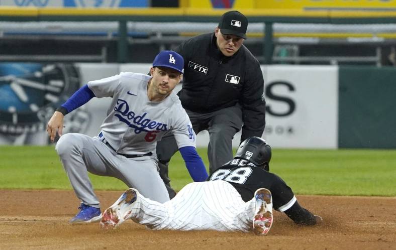 Jun 8, 2022; Chicago, Illinois, USA; Chicago White Sox center fielder Luis Robert (88) steals second bases Los Angeles Dodgers shortstop Trea Turner (6) makes a late tag during the fourth inning at Guaranteed Rate Field. Mandatory Credit: David Banks-USA TODAY Sports