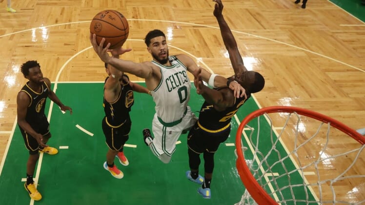 Jun 8, 2022; Boston, Massachusetts, USA; Boston Celtics forward Jayson Tatum (0) attempts a basket in front of Golden State Warriors forward Draymond Green (23) in the second half during game three of the 2022 NBA Finals at TD Garden. Mandatory Credit: Kyle Terada-USA TODAY Sports