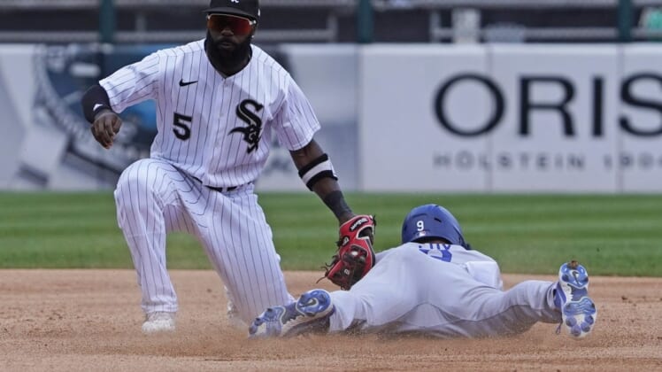 Jun 9, 2022; Chicago, Illinois, USA; Los Angeles Dodgers left fielder Gavin Lux (9) is tagged out at second base on a steal attempt by Chicago White Sox second baseman Josh Harrison (5) during the third inning  at Guaranteed Rate Field. Mandatory Credit: David Banks-USA TODAY Sports