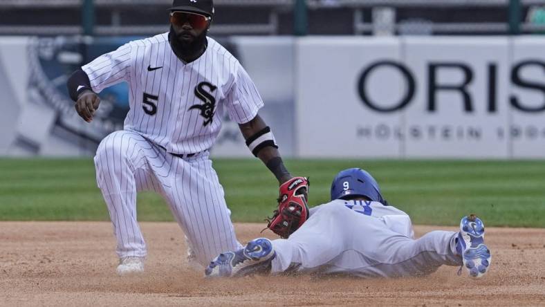 Jun 9, 2022; Chicago, Illinois, USA; Los Angeles Dodgers left fielder Gavin Lux (9) is tagged out at second base on a steal attempt by Chicago White Sox second baseman Josh Harrison (5) during the third inning  at Guaranteed Rate Field. Mandatory Credit: David Banks-USA TODAY Sports