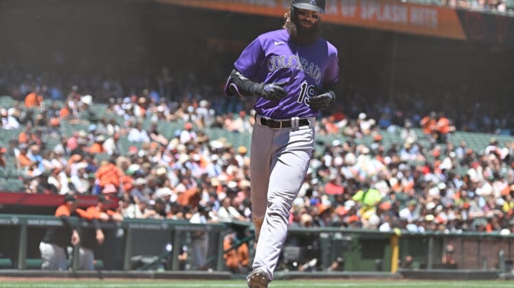 Jun 9, 2022; San Francisco, California, USA; Colorado Rockies designated hitter Charlie Blackmon (19) scores a run on a single by second baseman Brendan Rodgers (7) during the fourth inning against the San Francisco Giants at Oracle Park. Mandatory Credit: Robert Edwards-USA TODAY Sports