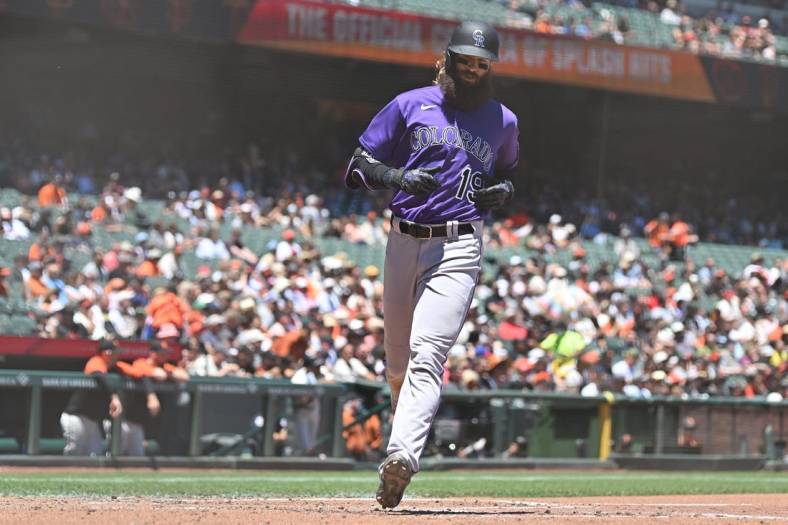 Jun 9, 2022; San Francisco, California, USA; Colorado Rockies designated hitter Charlie Blackmon (19) scores a run on a single by second baseman Brendan Rodgers (7) during the fourth inning against the San Francisco Giants at Oracle Park. Mandatory Credit: Robert Edwards-USA TODAY Sports