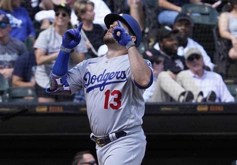 Jun 9, 2022; Chicago, Illinois, USA; Los Angeles Dodgers second baseman Max Muncy (13) gestures as he crosses home plate after hitting a three-run home run against the Chicago White Sox during the sixth inning at Guaranteed Rate Field. Mandatory Credit: David Banks-USA TODAY Sports