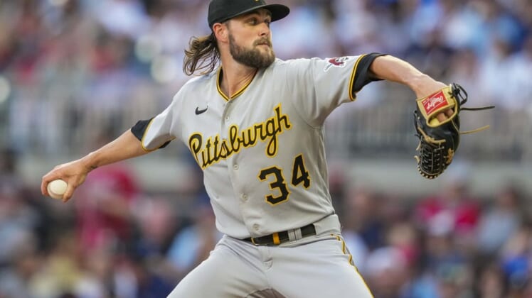 Jun 9, 2022; Cumberland, Georgia, USA; Pittsburgh Pirates starting pitcher JT Brubaker (34) pitches against the Atlanta Braves during the second inning at Truist Park. Mandatory Credit: Dale Zanine-USA TODAY Sports
