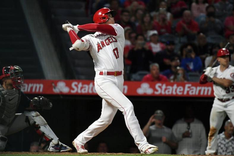 Jun 9, 2022; Anaheim, California, USA; Los Angeles Angels starting pitcher Shohei Ohtani (17) hits a home run in the fifth inning against the Boston Red Sox at Angel Stadium. Mandatory Credit: Richard Mackson-USA TODAY Sports