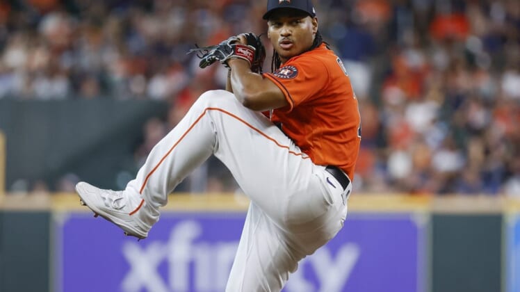 Jun 10, 2022; Houston, Texas, USA; Houston Astros starting pitcher Luis Garcia (77) delivers a pitch during the second inning against the Miami Marlins at Minute Maid Park. Mandatory Credit: Troy Taormina-USA TODAY Sports