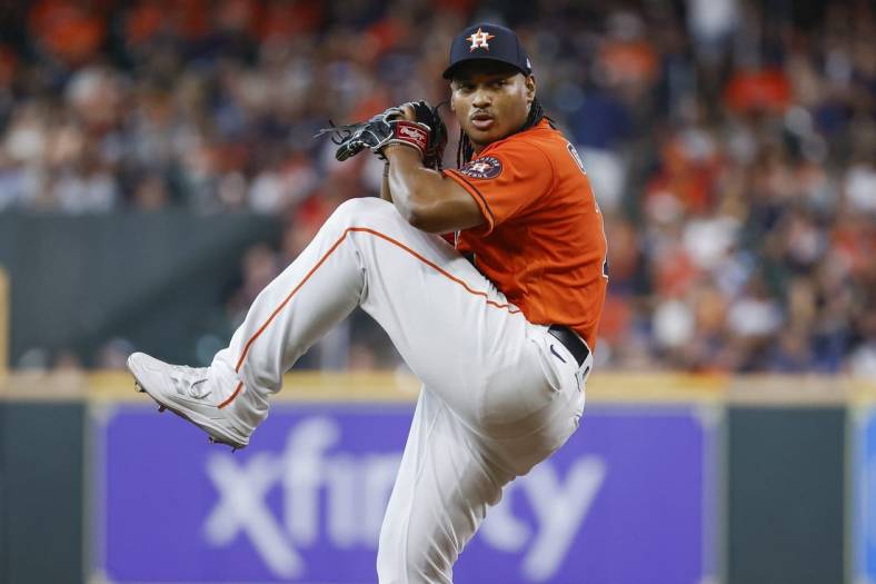 Jun 10, 2022; Houston, Texas, USA; Houston Astros starting pitcher Luis Garcia (77) delivers a pitch during the second inning against the Miami Marlins at Minute Maid Park. Mandatory Credit: Troy Taormina-USA TODAY Sports