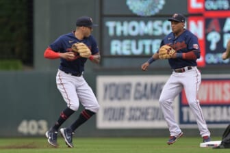 Jun 10, 2022; Minneapolis, Minnesota, USA; Minnesota Twins shortstop Carlos Correa (4) turns a double while second basemen Jorge Polanco (right) provides back up against the Tampa Bay Rays during the first inning at Target Field. Mandatory Credit: Jeffrey Becker-USA TODAY Sports