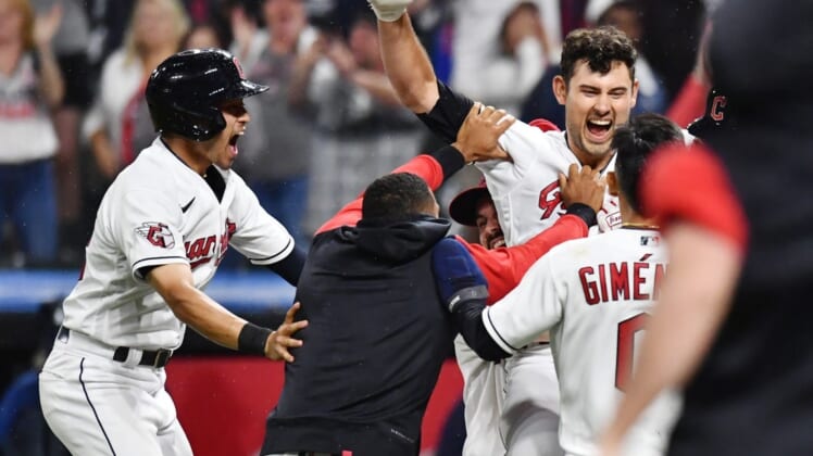 Jun 10, 2022; Cleveland, Ohio, USA; Cleveland Guardians catcher Luke Maile (12) celebrates after hitting a sacrifice fly during the ninth inning to plate the wining run against the Oakland Athletics at Progressive Field. Mandatory Credit: Ken Blaze-USA TODAY Sports