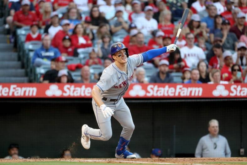 Jun 10, 2022; Anaheim, California, USA; New York Mets left fielder Mark Canha (19) hits an RBI double in the second inning against the Los Angeles Angels at Angel Stadium. Mandatory Credit: Kiyoshi Mio-USA TODAY Sports
