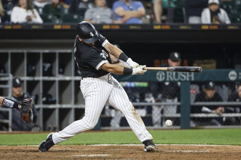 Jun 10, 2022; Chicago, Illinois, USA; Chicago White Sox third baseman Jake Burger (30) singles against the Texas Rangers during the eight inning at Guaranteed Rate Field. Mandatory Credit: Kamil Krzaczynski-USA TODAY Sports