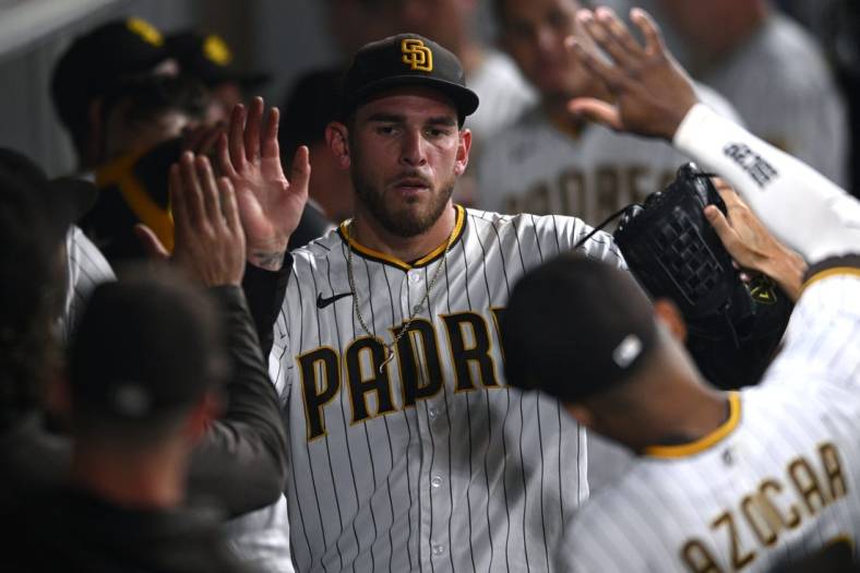 Jun 10, 2022; San Diego, California, USA; San Diego Padres starting pitcher Joe Musgrove (44) is greeted in the dugout after pitching the top of the sixth inning against the Colorado Rockies at Petco Park. Mandatory Credit: Orlando Ramirez-USA TODAY Sports