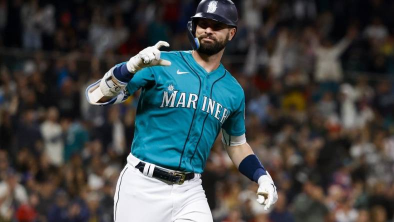 Jun 10, 2022; Seattle, Washington, USA; Seattle Mariners right fielder Jesse Winker (27) gestures towards the dugout  following his two-run home run against the Boston Red Sox during the fifth inning at T-Mobile Park. Mandatory Credit: Joe Nicholson-USA TODAY Sports