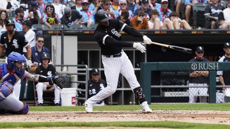 Jun 11, 2022; Chicago, Illinois, USA; Chicago White Sox center fielder Luis Robert (88) hits a one run single against the Texas Rangers during the second inning at Guaranteed Rate Field. Mandatory Credit: David Banks-USA TODAY Sports
